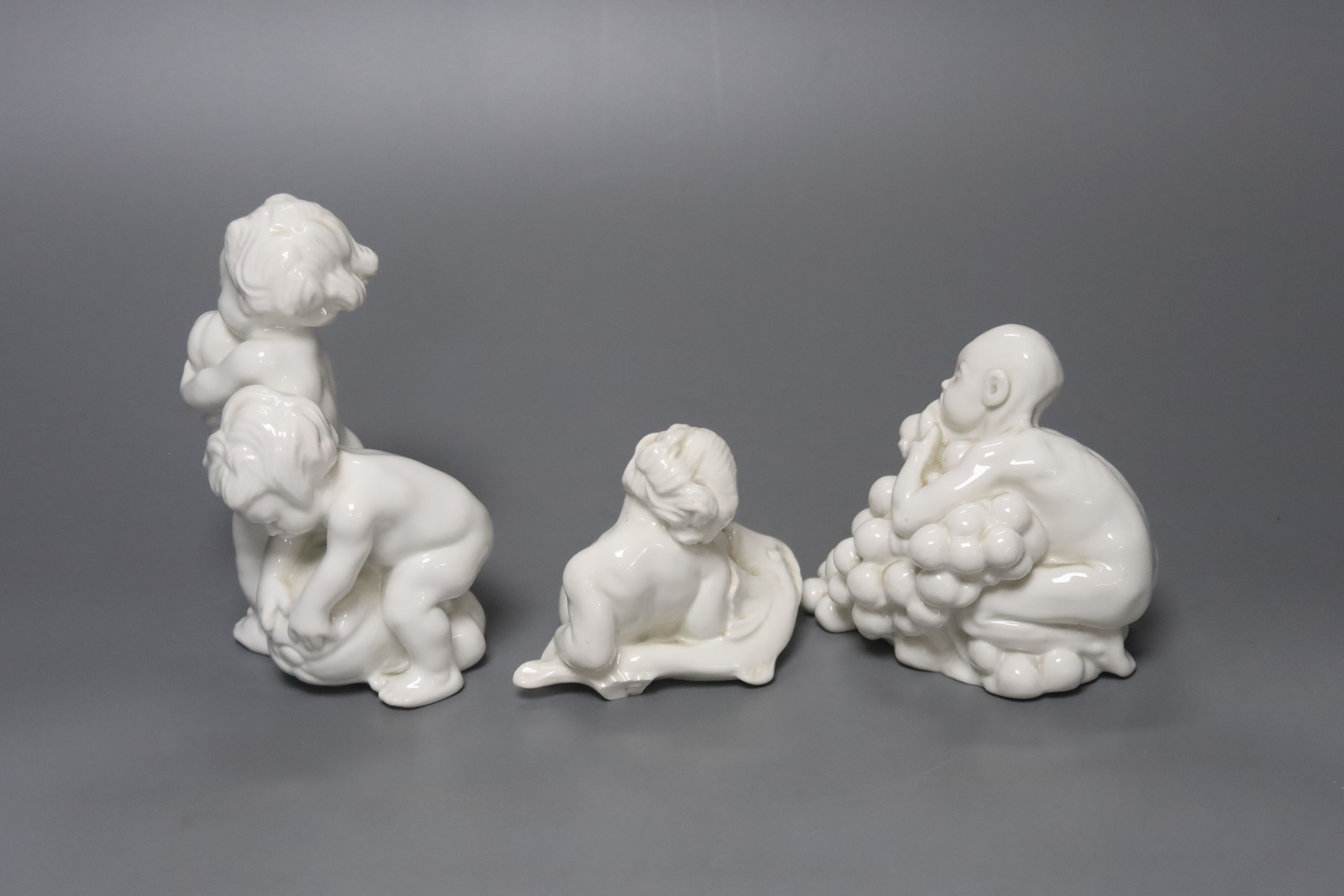 Kai Neilsen (1882-1924) for Bing & Grondahl, three white porcelain groups of children or cherubs, models 4021, 4033 and ?